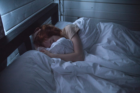 Woman sleeping in her bed