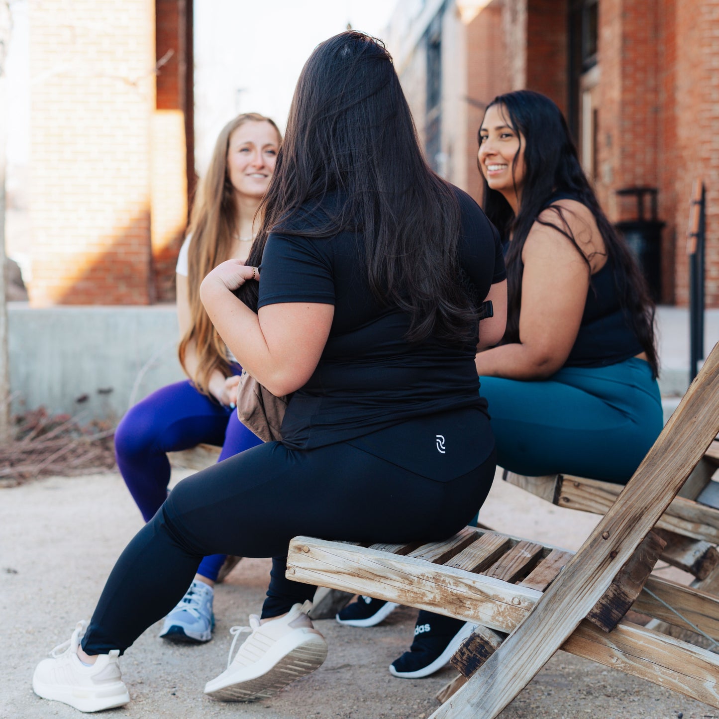 Models wearing black leggings for use in active lifestyles as well as casual living.