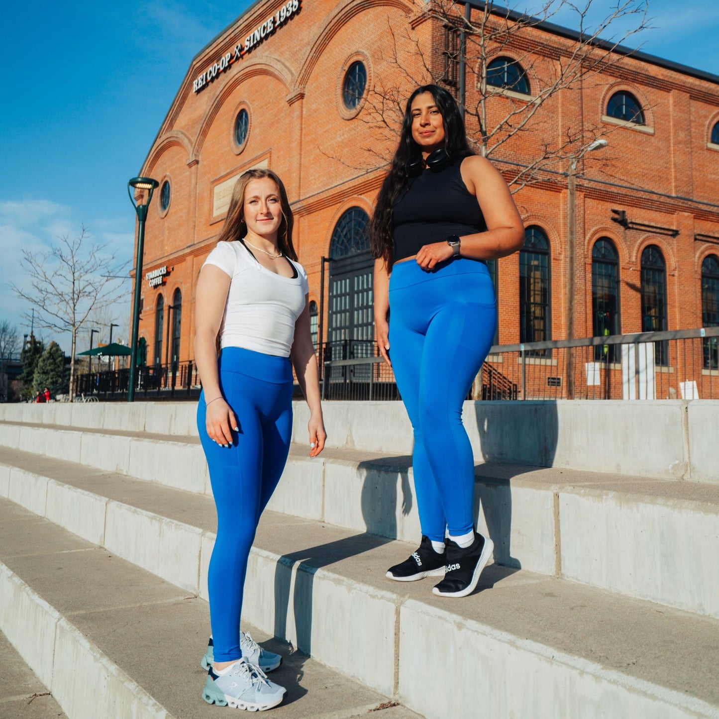 Models wearing cobalt leggings for use in active lifestyles as well as casual living.