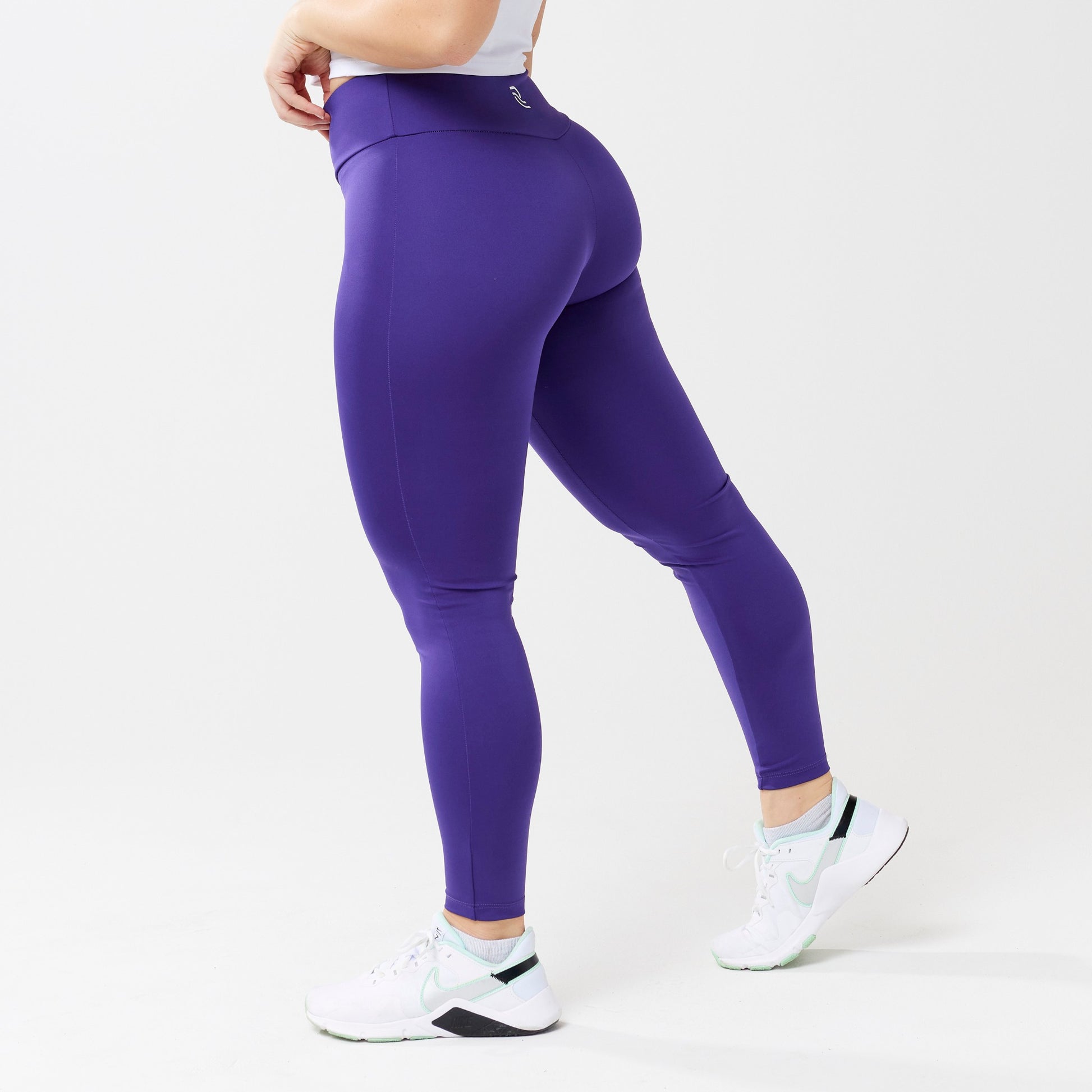 Model wearing indigo leggings for use in active lifestyles as well as casual living.