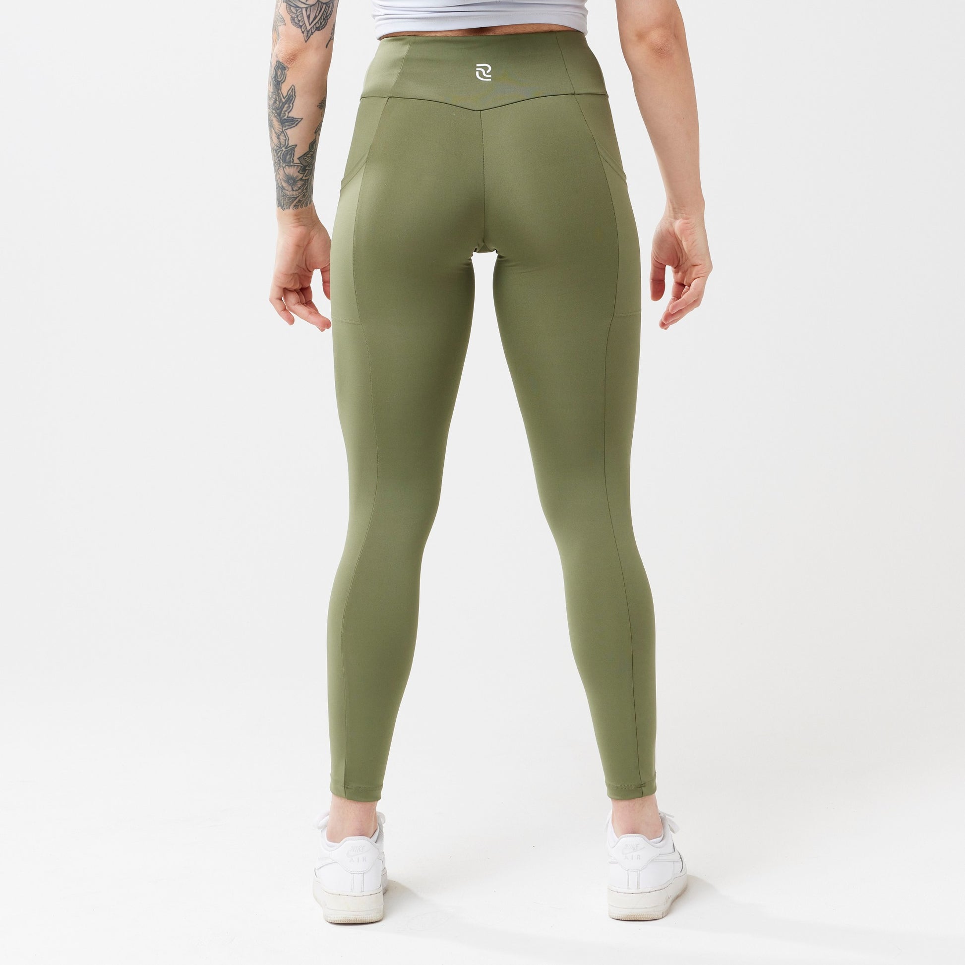 Model wearing sagewood leggings for use in active lifestyles as well as casual living.